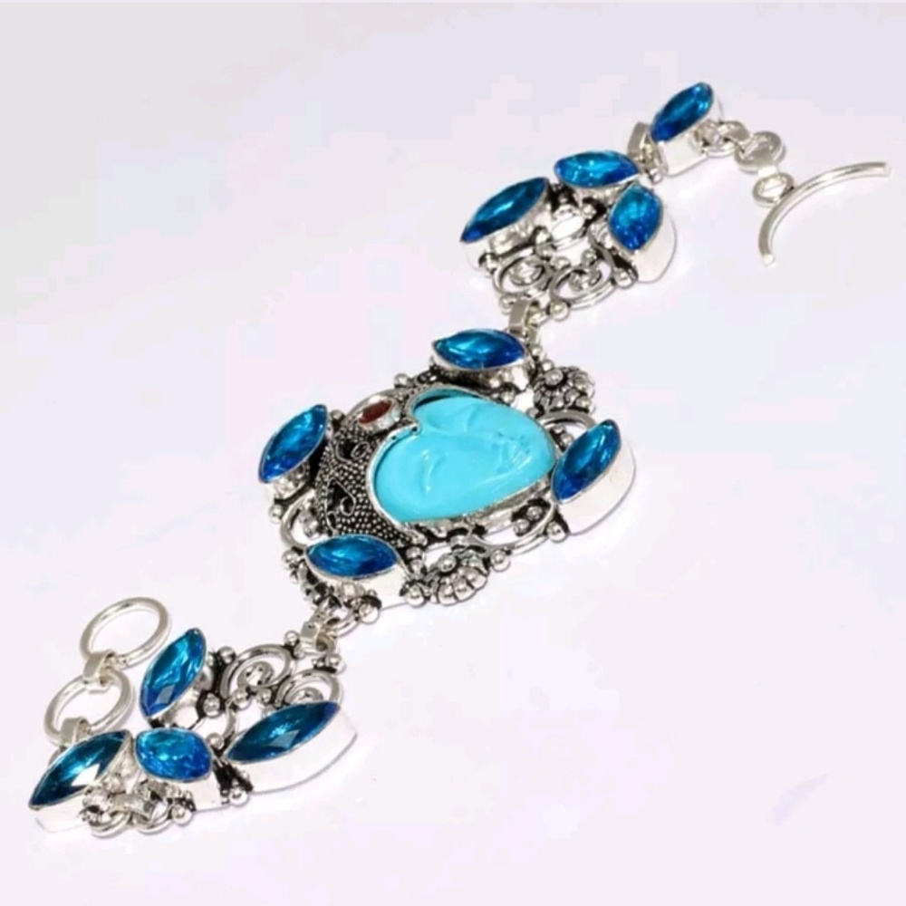 New Carved Goddess Blue Topaz and Garnet Silver Bracelet.